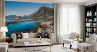 Living room wall mural showing rugged peaks above a quiet coastal bay