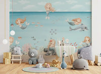 Pebbles and reef fronds line the sandy floor of the wall mural