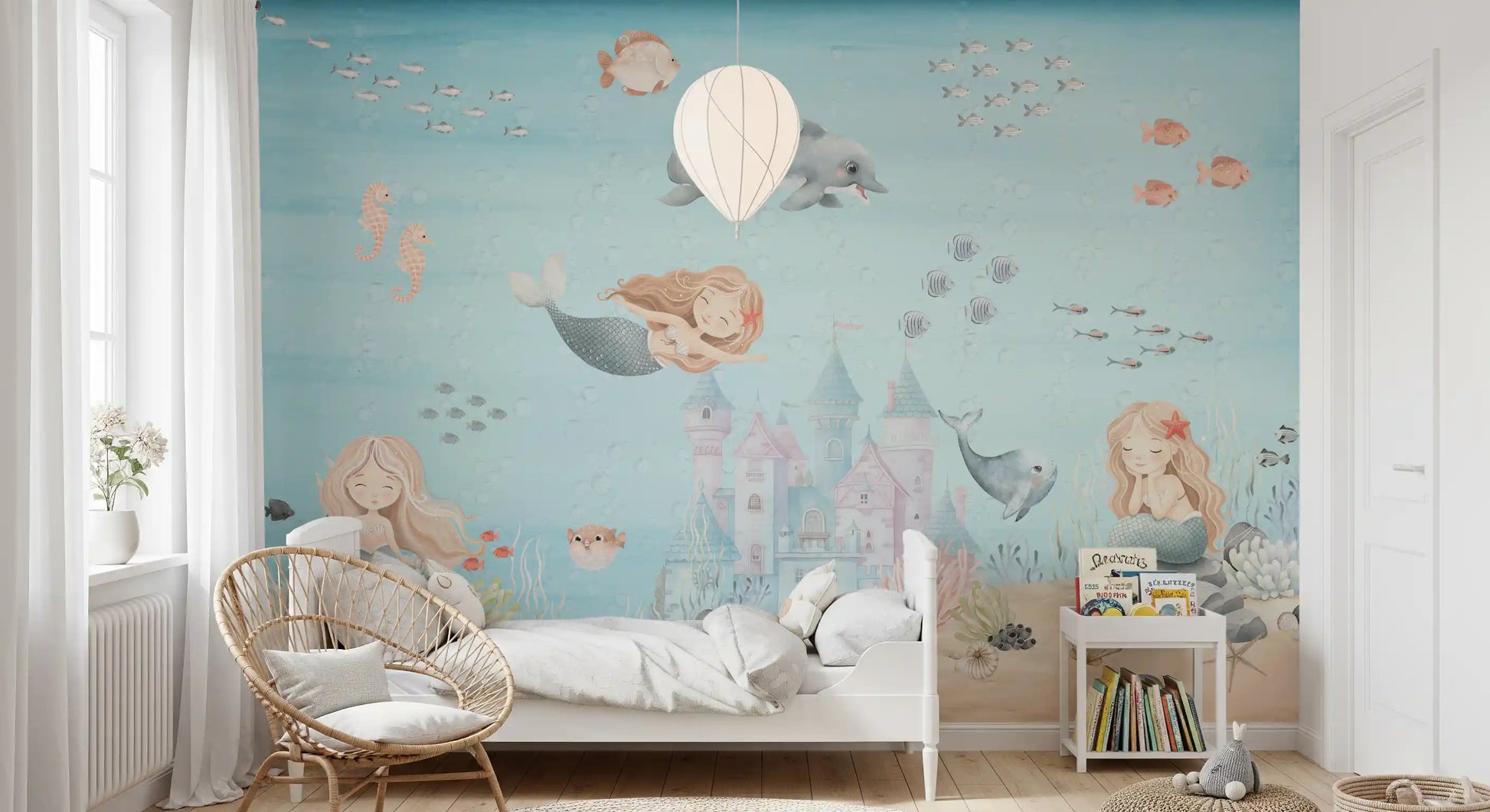 Pastel castle and a small whale shape the centre of this underwater wall mural