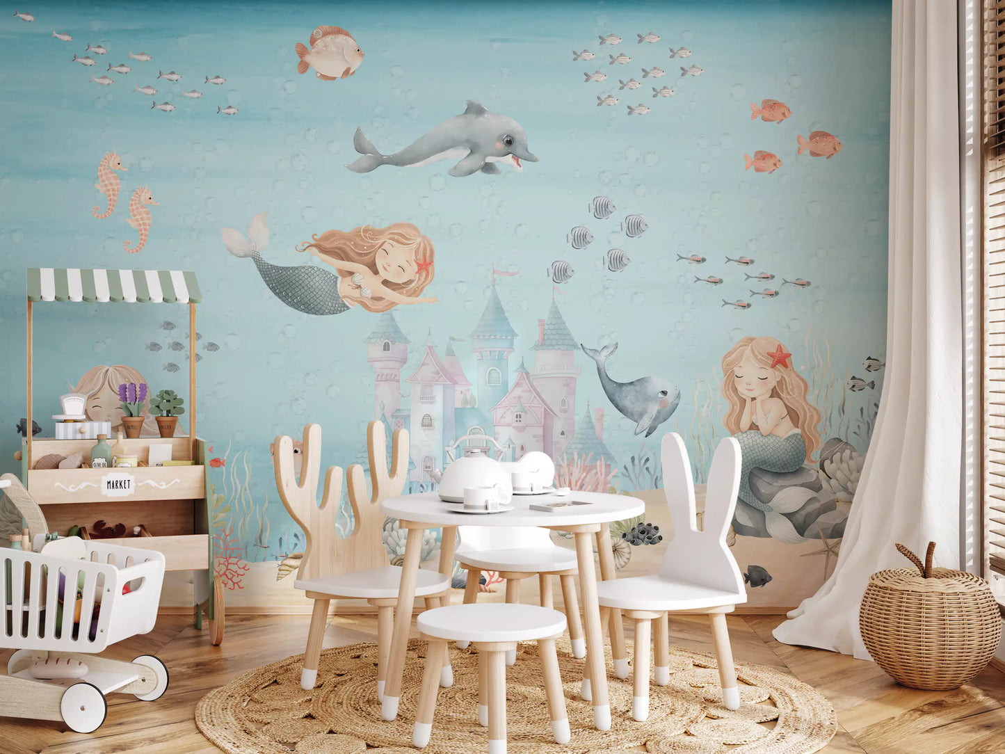 Kids play area carrying the underwater wall mural across one full side