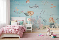 Kids bedroom set against the Deep Sea Mermaid Haven wall mural in aqua tones