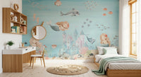 Toddler bedroom styled around a pastel mermaid and castle wall mural