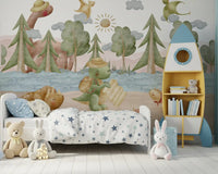 Pine trees and pastel hills painted into the Explorer's Journey wall mural