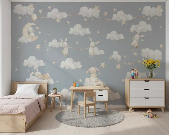 Pastel bunnies and clouds wall mural styled in a calm kids' room