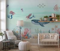 Cot nursery by the aqua Ocean Dream wall mural with whale and mermaids