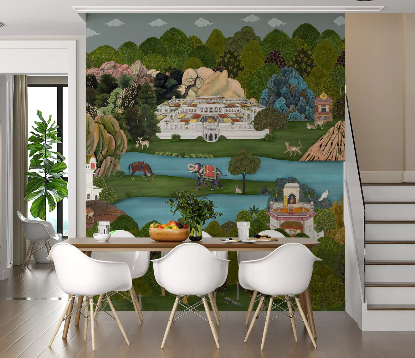 Dining room with the Mughal Oasis Landscape wall mural behind a pale table setting
