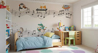 Playroom set up with a small table, bed and the cheerful musical wall mural 