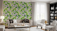 Full pattern hibiscus heads, curled buds, and greens across the wallpaper