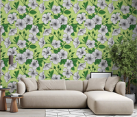 White hibiscus flowers spread across a living room in the Vintage Hibiscus wallpaper.