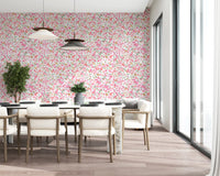 Daisy Dance wallpaper dresses the dining room in pink, coral and peach