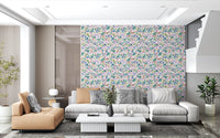 Tiny five-point petals appear across Dreamy Meadow wallpaper in pastel tones