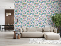 Pink, blue, green, peach, and purple daisies on Meadow Blooms wallpaper