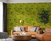 Overlapping leaves filling the gaps between blooms on this green floral wallpaper