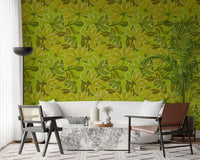 Lounge corner styled around the Green Bloom wallpaper near a cane sofa