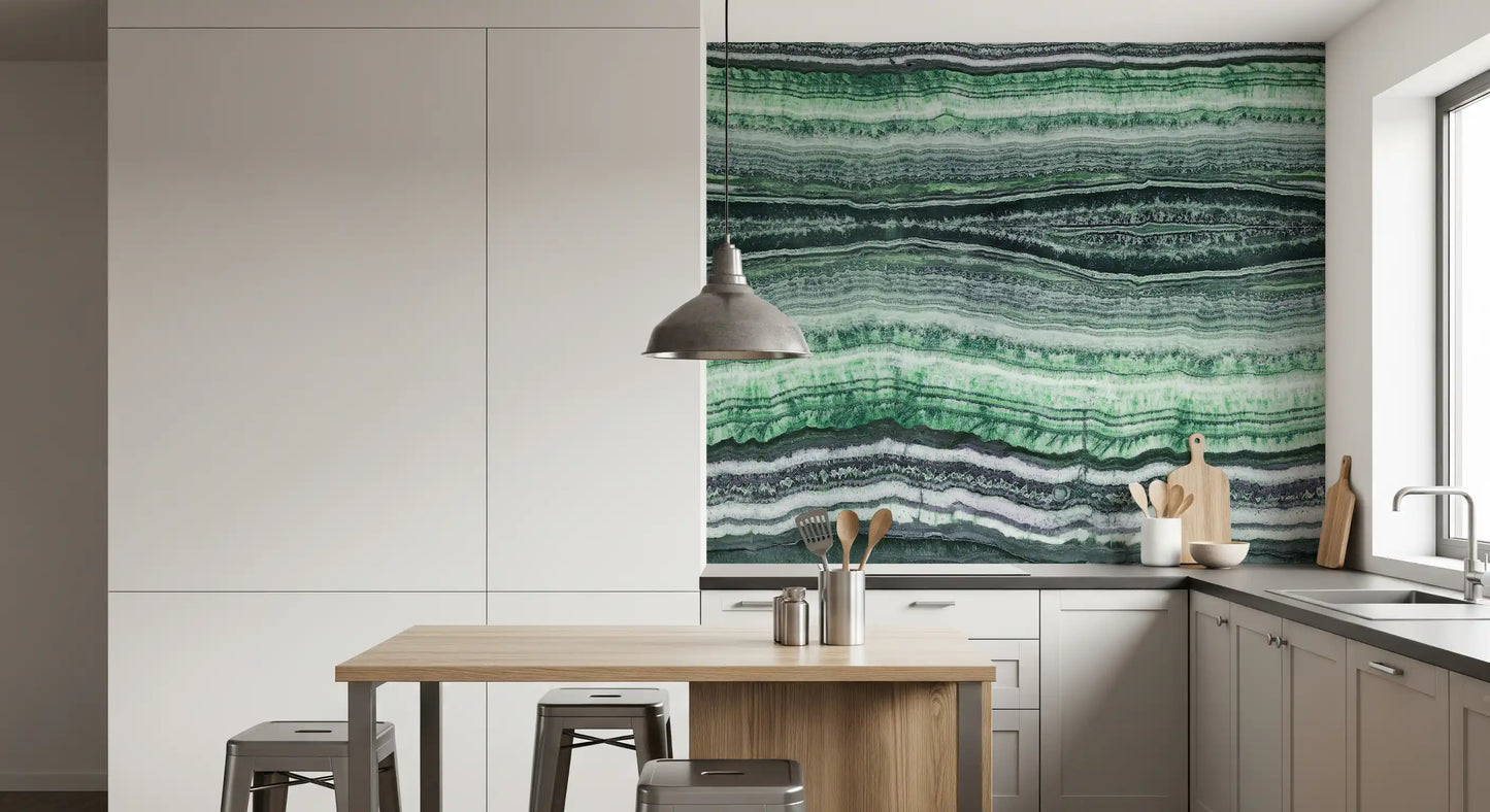 Mineral layering in green, white and charcoal across the wall mural surface.