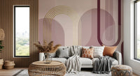 Blush geometric mural with rounded forms, burgundy lines, and gold accents