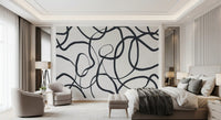 A relaxed pattern of loops moves through this wall mural beside a narrow Bedroom 