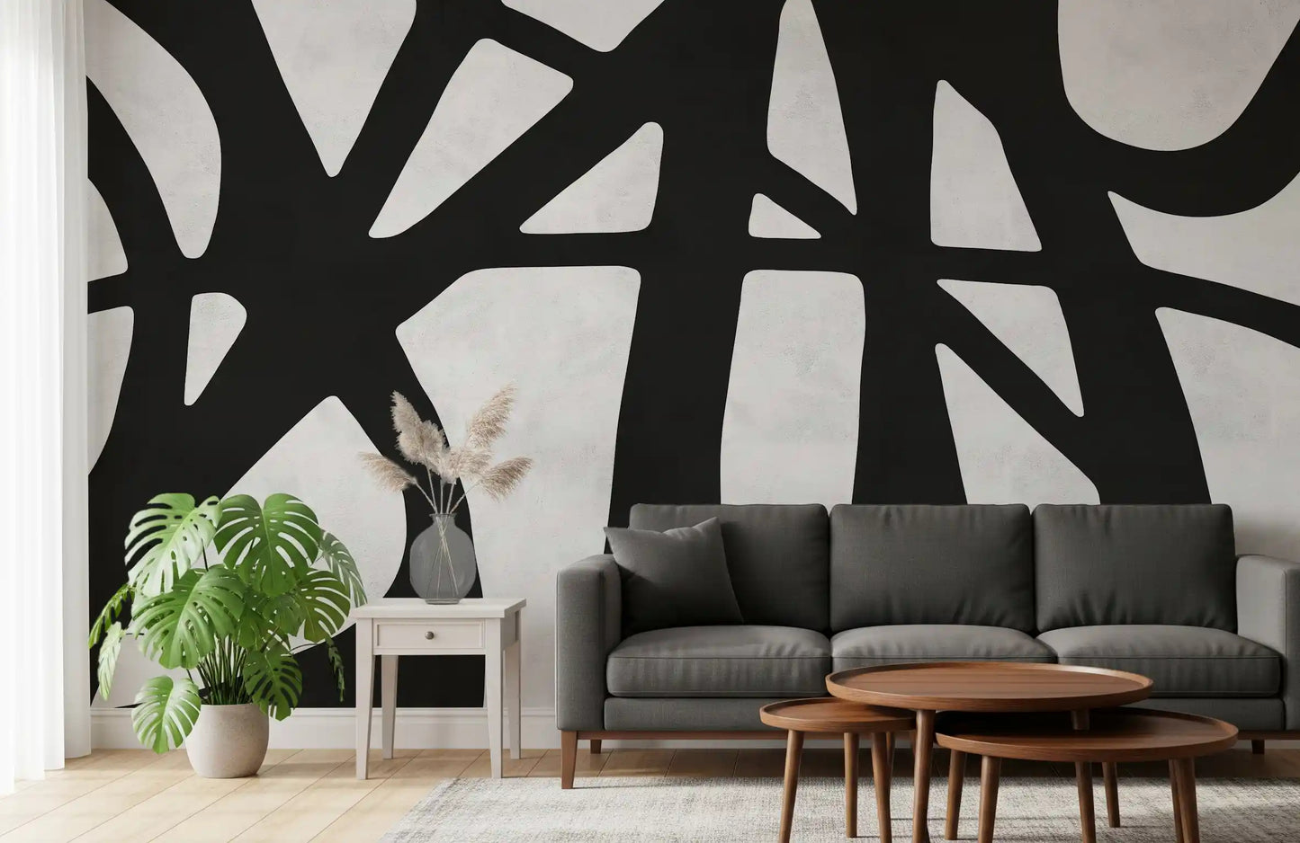 Monochrome abstract mural showing curved forms across a textured white base