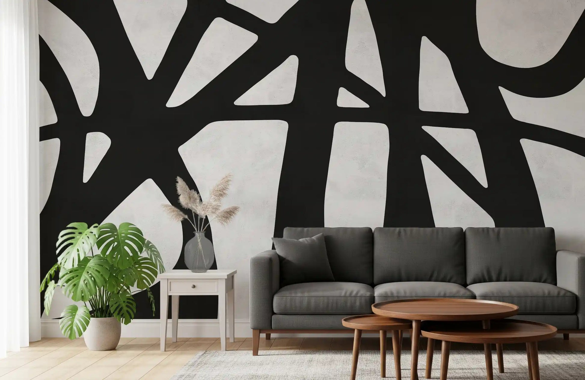 Monochrome abstract mural showing curved forms across a textured white base