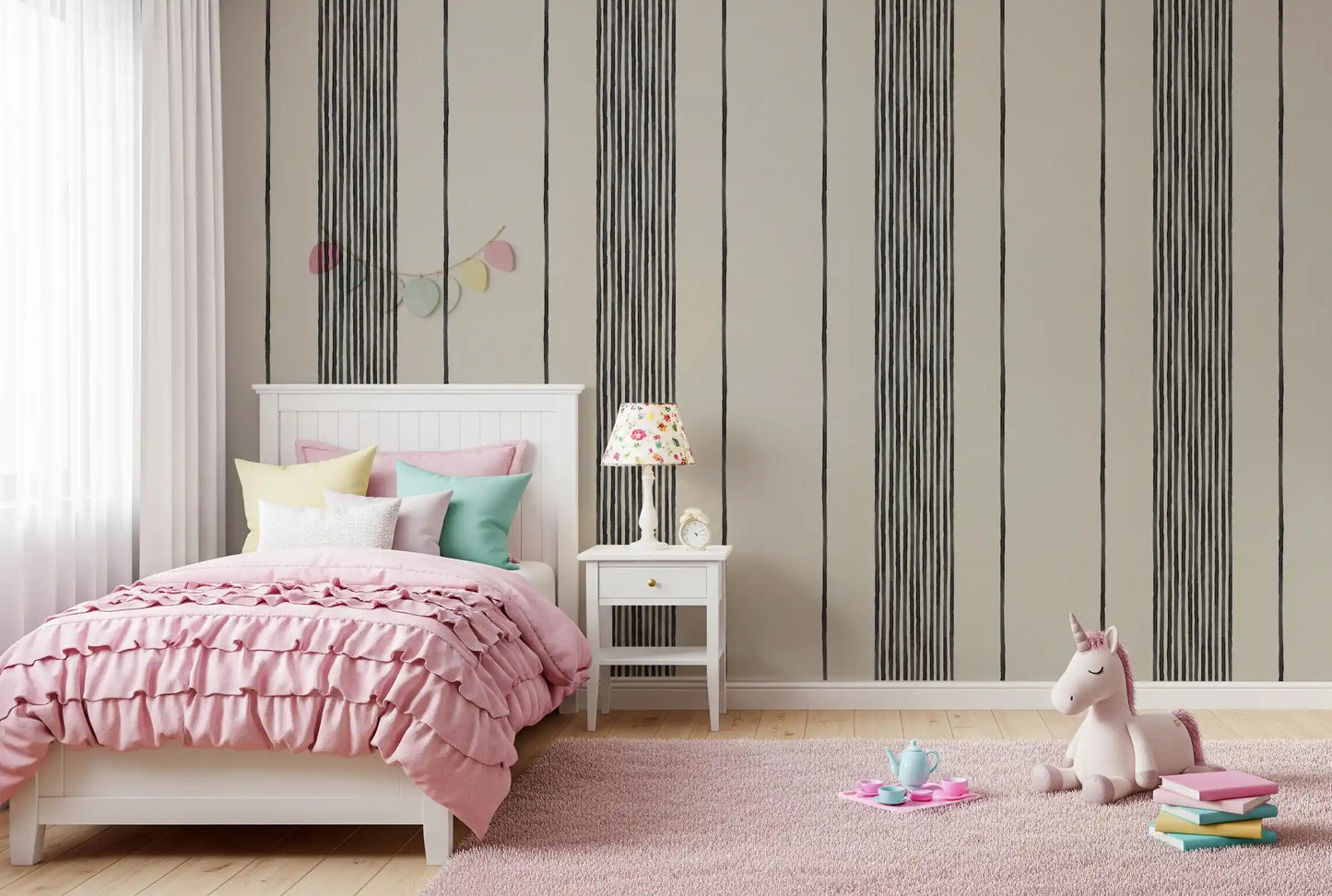 Brush-edged charcoal strokes give the striped linen wallpaper a hand-rendered cadence