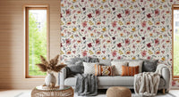 Rose, mustard, and plum blooms scatter on the Soft Floral Countryside wallpaper.
