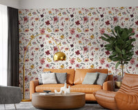 Painterly bouquets on the Floral Countryside wallpaper add cream notes to a lounge.