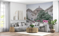 Blooming rose garden wall mural with cathedral skyline backdrop