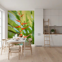 Botanical wall mural with fiery tropical flowers and green leaves