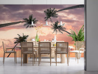 Warm sunset wall mural with tropical palm tree silhouettes