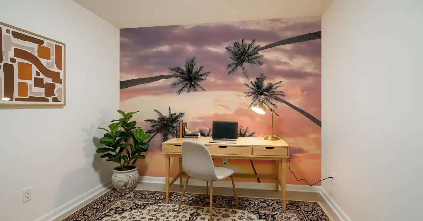 Coastal wall mural showing palm leaves and colourful sunset sky