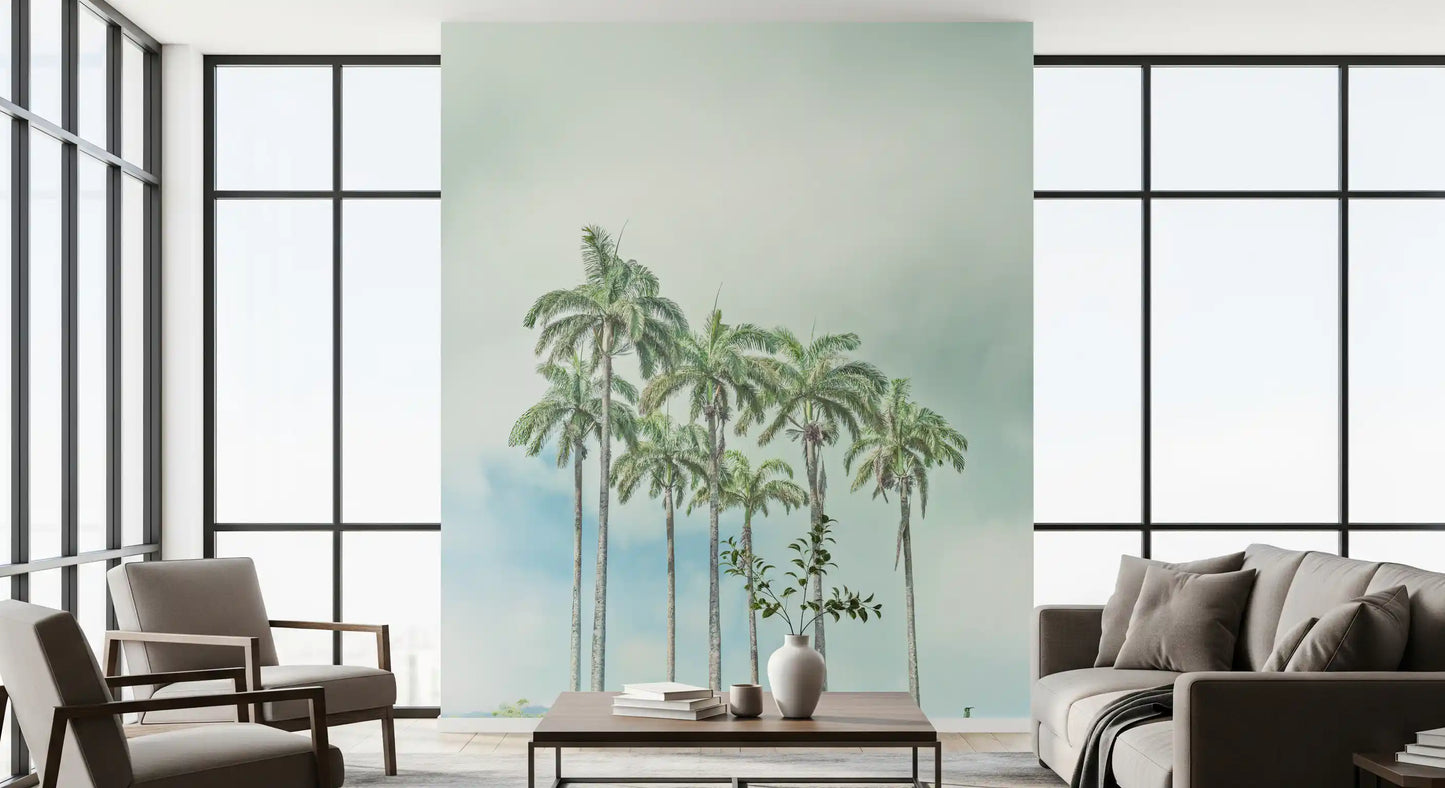 Palm lined coastline wall mural with soft blue water tones