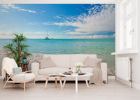 Ocean cove wall mural with natural sand and aqua blue tones