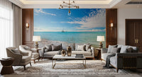 Sandy shoreline wall mural with turquoise sea and soft skies