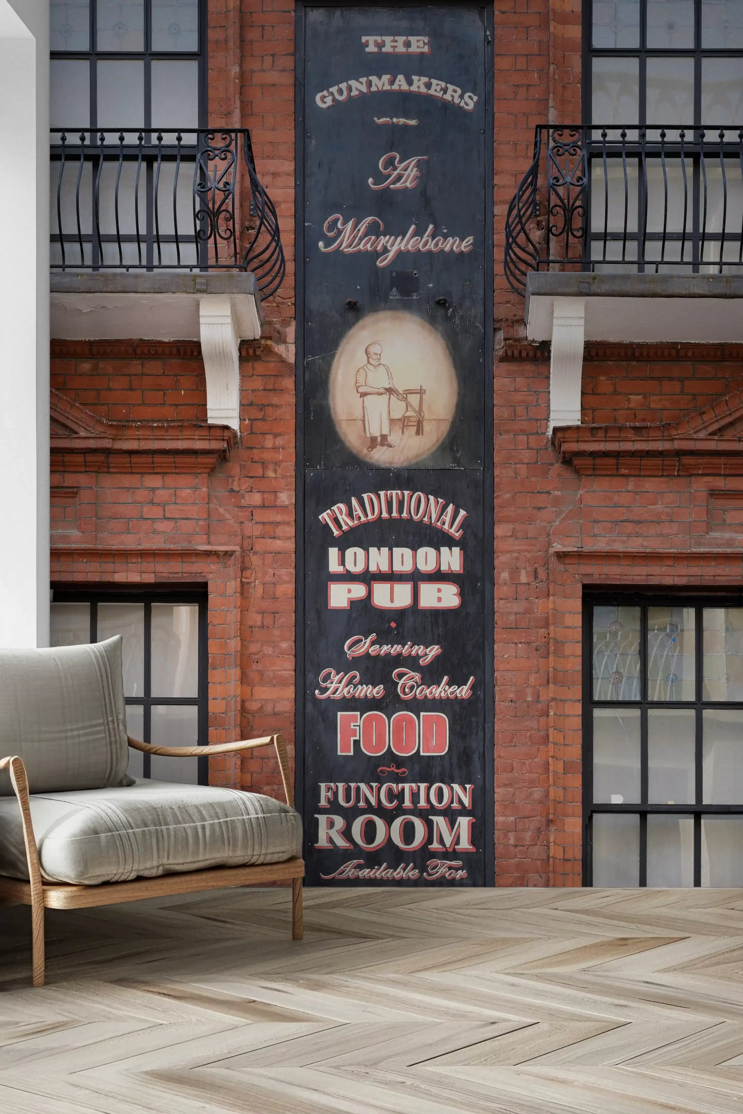 Brick building wall mural featuring iconic London pub frontage