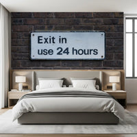 Brick wall mural featuring vintage exit sign and worn surfaces