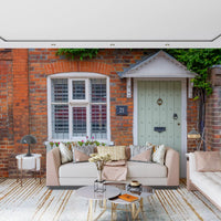 English cottage wall mural with blooming flowers and stone facade
