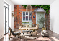 Countryside cottage wall mural with lush flowers and greenery

