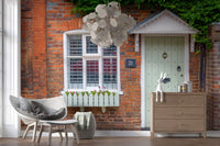 Garden cottage wall mural showcasing lush blooms and greenery
