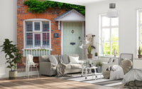 Country home wall mural with blooming flowers and stone walls
