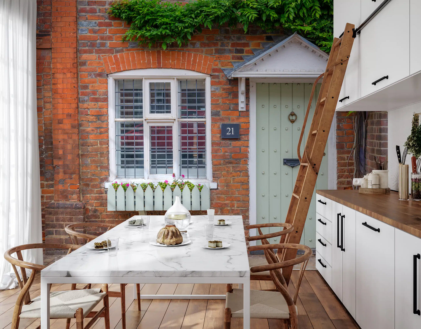 Floral cottage wall mural featuring colourful countryside planting

