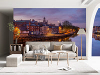 Evening waterfront wall mural with golden city reflections