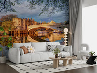 Waterfront architecture wall mural with golden river reflections