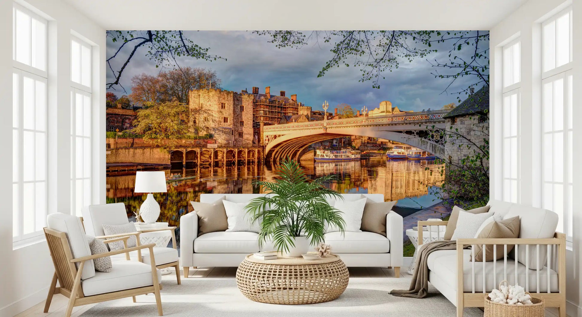 Historic town wall mural with reflections across a calm river