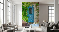 Blue door wall mural inspired by Mediterranean village charm