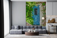 Mediterranean wall mural with bright blue door and stone textures