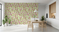Above a dining room, this Blooming Rose Trellis wallpaper layers vines, buds and heads.
