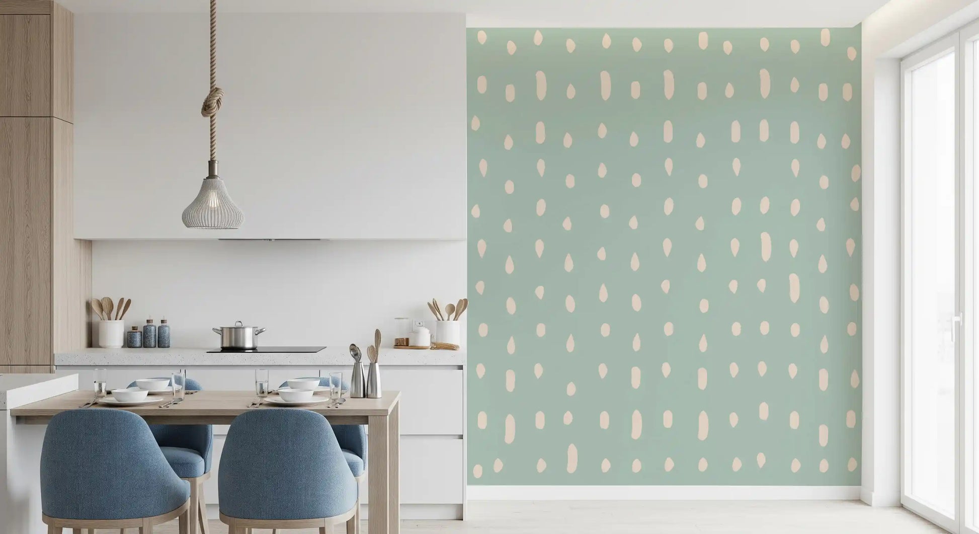 Kitchen and dining area setting where a sage Seed Dots wall mural fills the back