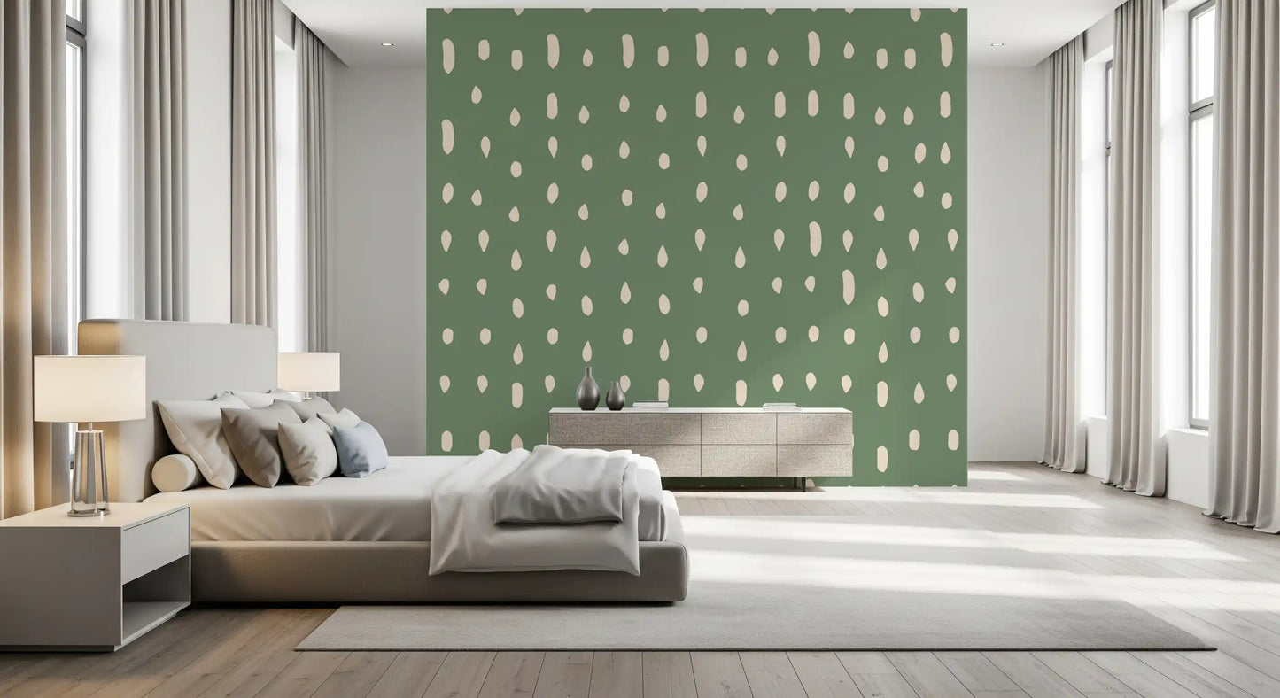 Vertical drop motifs in cream travel down a sage green Mid Century Seed Dots wall mural.