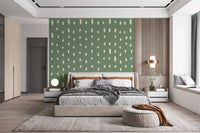 Drop shapes on sage green give a bedroom the Mid Century Seed Dots wall mural feel.