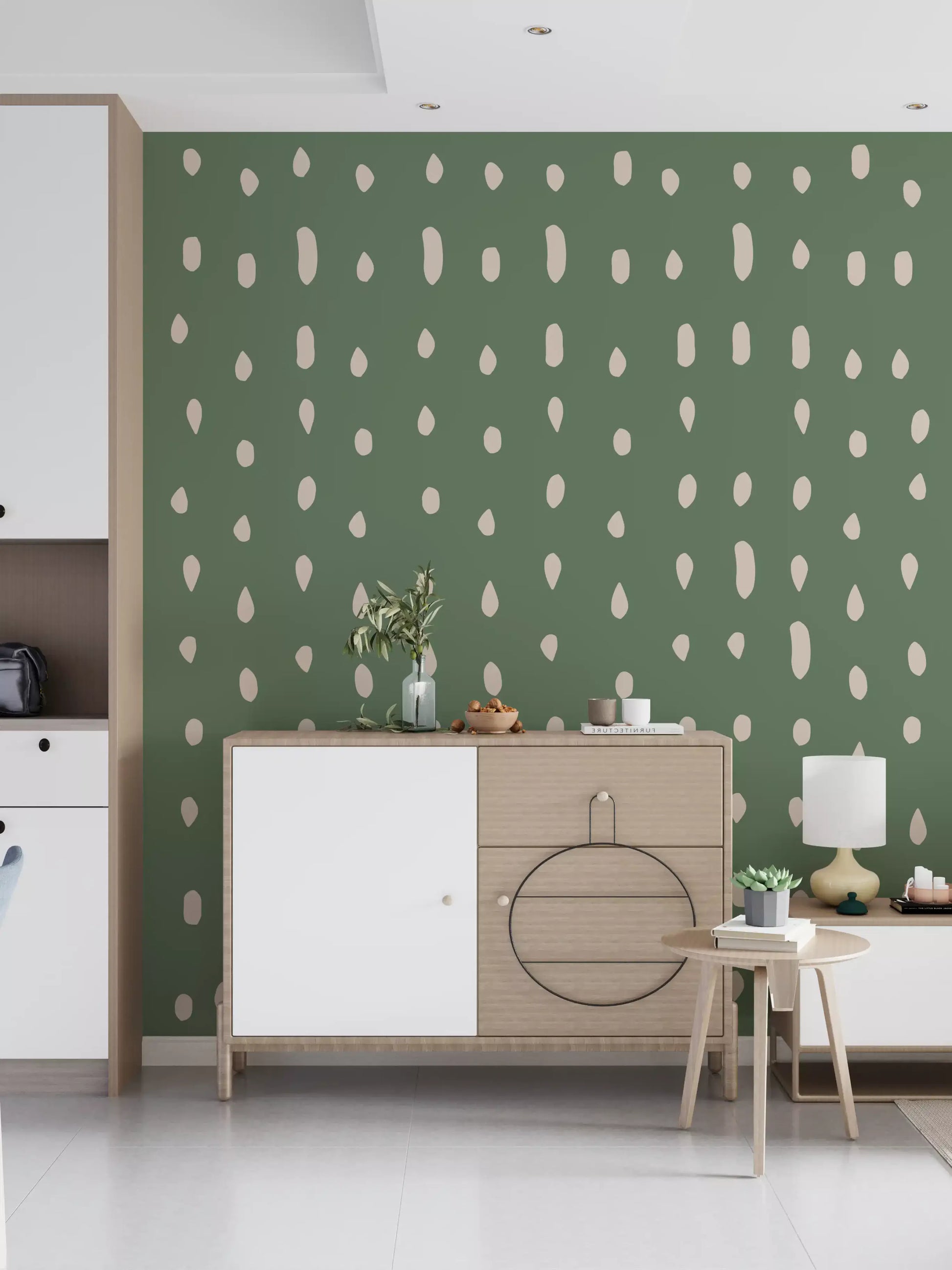 Tapered cream shapes sit on sage green in the Mid Century Seed Dots wall mural.